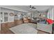 Open living room with hardwood floors and a view into the kitchen at 1409 Lake Marion Dr, Apopka, FL 32712