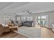 Spacious living room with access to a patio and a view of the water at 1409 Lake Marion Dr, Apopka, FL 32712