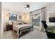 Bedroom with a queen bed and built-in workspace at 1422 Tierra Cir, Winter Park, FL 32792