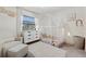 Charming Bedroom with crib, dresser, and plenty of natural light at 1422 Tierra Cir, Winter Park, FL 32792