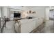 Spacious living area with sectional sofa, TV, and access to the bathroom at 1422 Tierra Cir, Winter Park, FL 32792