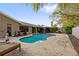 Inviting kidney-shaped pool with surrounding patio at 1422 Tierra Cir, Winter Park, FL 32792