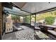 Cozy screened porch with seating and a play area at 1422 Tierra Cir, Winter Park, FL 32792