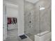 Walk-in shower with glass enclosure and adjacent closet at 15155 Mayberry Dr, Winter Garden, FL 34787