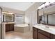 Bathroom with corner tub and double vanity at 1827 Pisgah Ln, Apopka, FL 32712