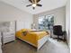 Cozy bedroom with a queen-size bed, and an office space at 1827 Pisgah Ln, Apopka, FL 32712