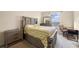 Bright bedroom with double bed, nightstand and workspace at 1827 Pisgah Ln, Apopka, FL 32712