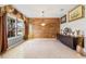 Dining room with wood-look wall, tile floor, and natural light at 1827 Pisgah Ln, Apopka, FL 32712