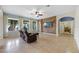 Relaxing living room with a reclining sofa and wood-look accent wall at 1827 Pisgah Ln, Apopka, FL 32712