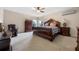 Main bedroom with large bed and built-in dresser at 1827 Pisgah Ln, Apopka, FL 32712