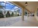 Spacious covered patio with fire pit and outdoor kitchen at 1827 Pisgah Ln, Apopka, FL 32712