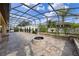 Large covered patio with fire pit and sitting area at 1827 Pisgah Ln, Apopka, FL 32712