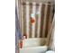 Bathroom with shower/tub and tiled walls at 262 Scottsdale Sq # 262, Winter Park, FL 32792