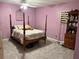 Bedroom with a post bed, ceiling fan, and purple walls at 262 Scottsdale Sq # 262, Winter Park, FL 32792