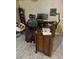 Home office with L-shaped desk, computer, and books at 262 Scottsdale Sq # 262, Winter Park, FL 32792