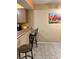 Small kitchen with breakfast bar and two stools at 262 Scottsdale Sq # 262, Winter Park, FL 32792