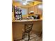 Kitchen with cabinets, appliances, and breakfast bar at 262 Scottsdale Sq # 262, Winter Park, FL 32792