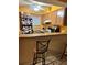 Kitchen boasts cabinets, appliances, and breakfast bar at 262 Scottsdale Sq # 262, Winter Park, FL 32792