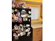 Black refrigerator with many Gathering photos and magnets at 262 Scottsdale Sq # 262, Winter Park, FL 32792