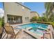 Inviting backyard oasis featuring a refreshing pool, spa, and patio at 611 Lasso Dr, Kissimmee, FL 34747
