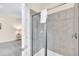 Shower stall with gray tile at 611 Lasso Dr, Kissimmee, FL 34747