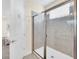 Bathroom with a shower and tiled walls at 611 Lasso Dr, Kissimmee, FL 34747