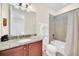 Bathroom with tub, shower, and granite vanity at 611 Lasso Dr, Kissimmee, FL 34747