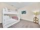 Bunk bed in bedroom with added TV at 611 Lasso Dr, Kissimmee, FL 34747