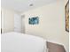 Bright bedroom with a comfortable bed and wall-mounted TV at 611 Lasso Dr, Kissimmee, FL 34747
