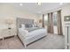 Spacious bedroom with king-size bed and neutral decor at 611 Lasso Dr, Kissimmee, FL 34747