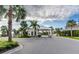 Gated community entrance with palm trees and landscaping at 611 Lasso Dr, Kissimmee, FL 34747