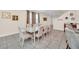 Open concept dining room with a large table at 611 Lasso Dr, Kissimmee, FL 34747