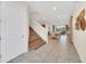Bright entryway with tiled floors and staircase at 611 Lasso Dr, Kissimmee, FL 34747