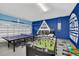 Fun game room with ping pong, foosball, and arcade game at 611 Lasso Dr, Kissimmee, FL 34747
