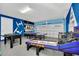 Awesome game room with ping pong, foosball and an arcade game at 611 Lasso Dr, Kissimmee, FL 34747
