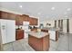 Spacious kitchen with island, granite countertops, and stainless steel appliances at 611 Lasso Dr, Kissimmee, FL 34747