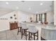 Kitchen with granite countertops and bar seating at 611 Lasso Dr, Kissimmee, FL 34747
