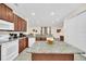 Modern kitchen featuring granite countertops and ample cabinetry at 611 Lasso Dr, Kissimmee, FL 34747