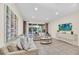 Relaxing living area with two sofas, a coffee table, and a large TV at 611 Lasso Dr, Kissimmee, FL 34747