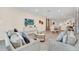 Open living space showcasing comfortable seating and a view of the dining area at 611 Lasso Dr, Kissimmee, FL 34747