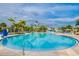 Large resort-style pool with a waterslide and plenty of lounge chairs at 611 Lasso Dr, Kissimmee, FL 34747