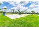 Outdoor sand volleyball court with lush green surroundings at 611 Lasso Dr, Kissimmee, FL 34747