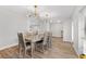 Elegant dining room with modern light fixtures and hardwood floors at 6829 Bittersweet Ln, Orlando, FL 32819
