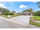 Single-story home with three-car garage and large driveway at 6829 Bittersweet Ln, Orlando, FL 32819