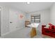 Spacious home office with built-in shelving and plenty of natural light at 6829 Bittersweet Ln, Orlando, FL 32819