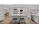 Modern kitchen with white cabinets and a large island at 6829 Bittersweet Ln, Orlando, FL 32819