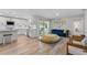 Living area features hardwood floors, an open floor plan, and kitchen views at 6829 Bittersweet Ln, Orlando, FL 32819
