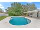 Relaxing kidney-shaped pool, perfect for outdoor entertaining at 6829 Bittersweet Ln, Orlando, FL 32819