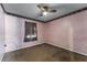 Simple bedroom with neutral-toned walls and carpet flooring at 7879 Toledo St, Orlando, FL 32822