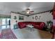 Living room with sectional sofa, coffee table, and carpet at 7879 Toledo St, Orlando, FL 32822